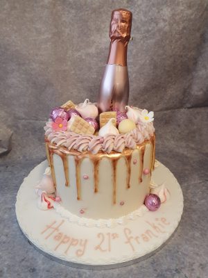 DC031 Drip cake with mini champagne bottle - Ravens Bakery of Essex Ltd